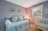 Bedroom featuring carpet and baseboard heating