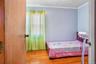Light wood-finish flooring throughout the room