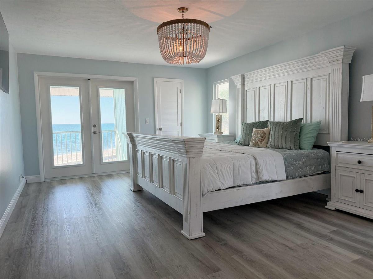 Primary bedroom with Gulf views and direct access to the covered porch.
