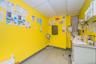 Misc room with a drop ceiling and light flooring