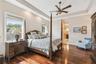 Spacious owner's suite with wonderful solid cherry flooring.