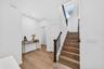 Stair landing, half bathroom and mud room
