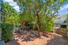 Beautifully lanscaped patio located on the ground level