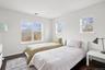 Bedroom with visible vents, baseboards, and dark wood finished floors