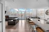 Living room with french doors, wood-type flooring, and plenty of natural light