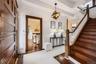 Grand original staircase accented by spiral banister