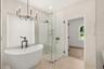 PRIMARY SPA RETREAT WITH SEPARATE SOAKING TUB AND GLASS-ENCLOSED SHOWER