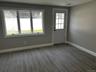 Doorway to outside featuring baseboards and wood tiled floors