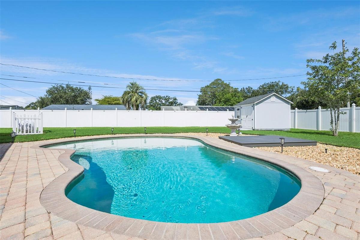 Backyard Oasis with Pool/Storage Shed and Fenced-In Backyard