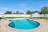 Backyard Oasis with Pool/Storage Shed and Fenced-In Backyard