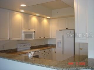 Gourmet kitchen with granite & lots of cabinets & drawers,