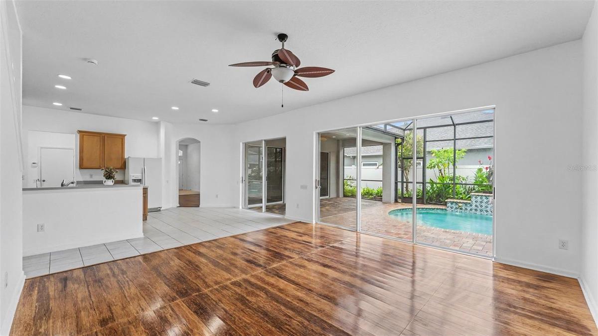 Family room with lots of sliders inviting lots of natural light