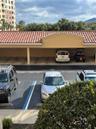 Reserved carport across from front door to lobby.
