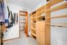 The second primary closet with extended storage at the rear