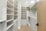 Walk in closet featuring light wood-style flooring