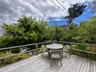 Deck with outdoor dining space and a grill