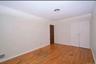 3rd floor bedroom featuring light wood-style flooring, ornamental molding, and a closet