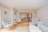 Living area featuring light wood-type flooring, a chandelier, and recessed lighting