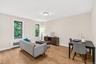 Living room/dining and work space on main level -upper unit