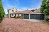 Mediterranean / spanish-style house with stucco siding, a 3 car attached garage, a tiled roof, and pavered driveway