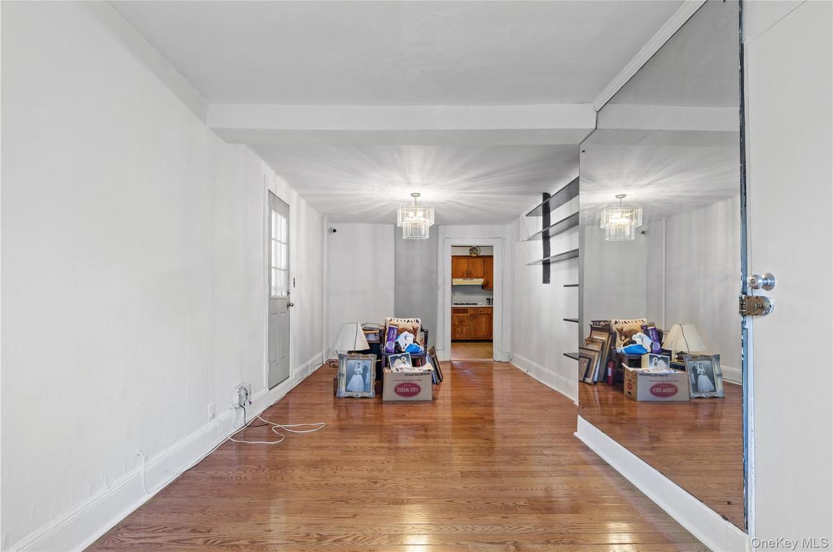 Dining area featuring wood finished floors and a chandelier
