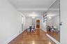 Dining area featuring wood finished floors and a chandelier