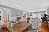 Dining space with french doors, hardwood / wood-style flooring, and wainscoting