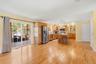 Family room/kitchen nook with view of the rear three season room.