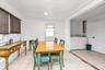 Dining area featuring light tile patterned floors, washing machine and dryer, and recessed lighting