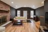 Brick fireplace with stone hearth and wood mantel