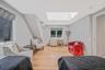 Bedroom with a skylight, light wood finished floors, and recessed lighting