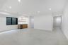 Unfurnished living room featuring recessed lighting, wet bar, and beverage cooler
