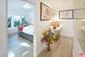 Hallway leading to staged bedr