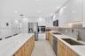 Oversized kitchen sink and tons of storage cabinets and drawers