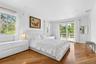 Bedroom featuring light wood-style flooring, access to exterior, and recessed lighting