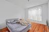 Bedroom with wood finished floors
