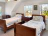 Bedroom featuring carpet flooring and a ceiling fan