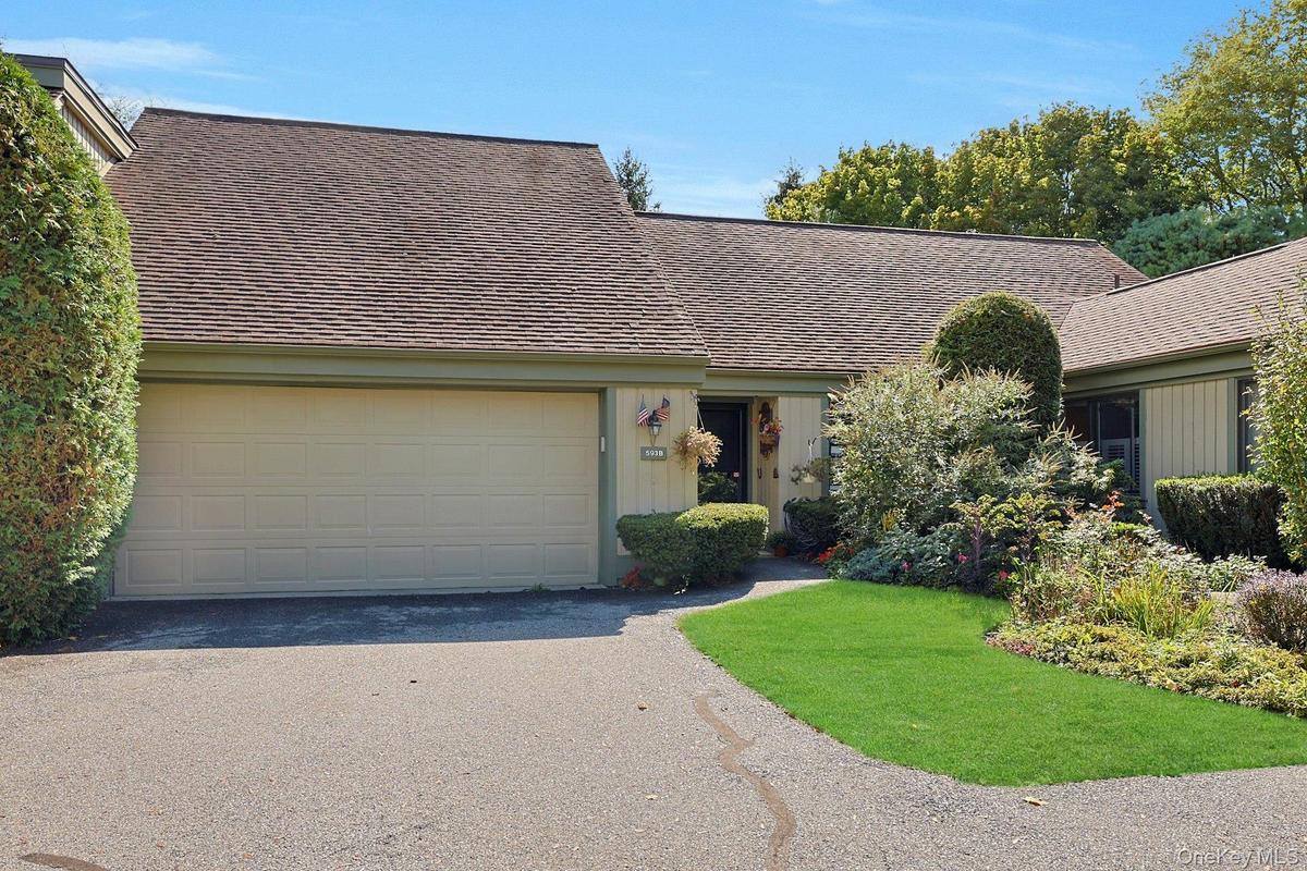 View of front of 593B,  front yard, and 2 car garage