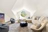 Second Floor Media_Living area with vaulted ceiling and wood finished floors