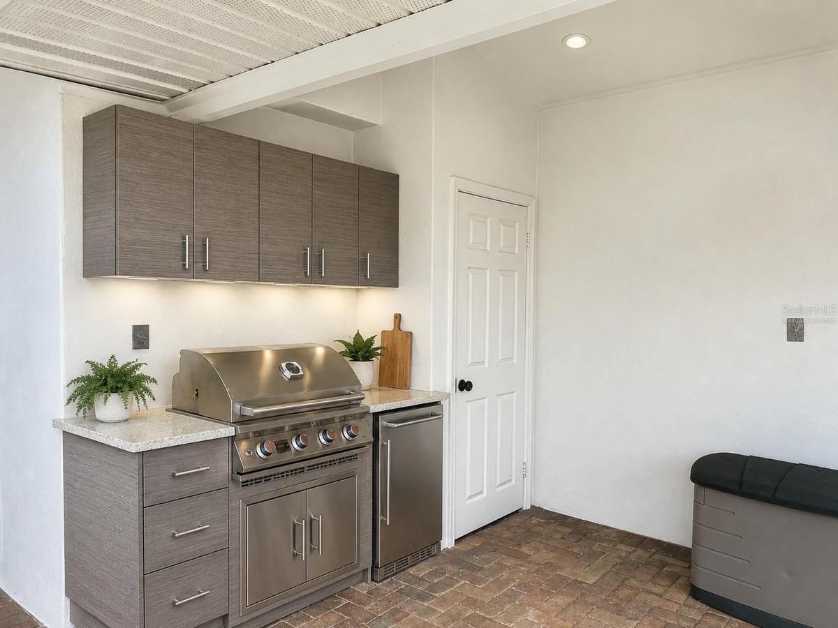 Virtually staged rendering of outdoor kitchen set up where the wall has plumbing for gas and electrical.