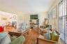 Living area featuring wood finished floors and a premium fireplace