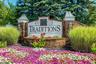 Traditions Sign and Flowers