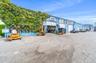 View of commercial property featuring a garage