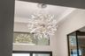 The foyer has soaring ceilings and designer lighting.