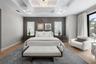 Coffered ceilings with recessed lighting, designer wallpaper accents, and an elegant chandelier create a calming yet sophisticated atmosphere.