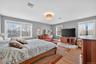 Bedroom with light wood-style floors and baseboards