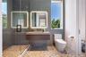 Bathroom featuring a shower stall, tile walls, and vanity