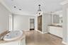 Primary suite with private balcony, huge en suite bathroom and walk-in closet