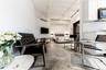 Living room featuring finished concrete flooring and a wall unit AC