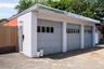 the detached 3 bay garage complete with an office, half bathroom and heating system all on separate utilities.